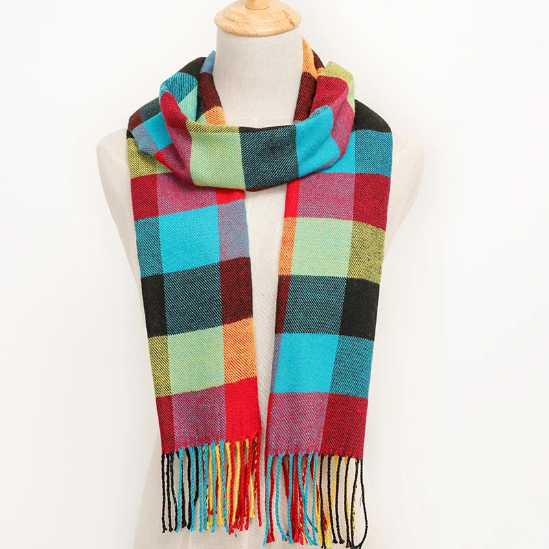 Multicoloured plaid scarf on a mannequin against a white background