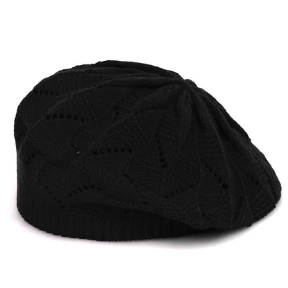 Black knit beanie on a white background