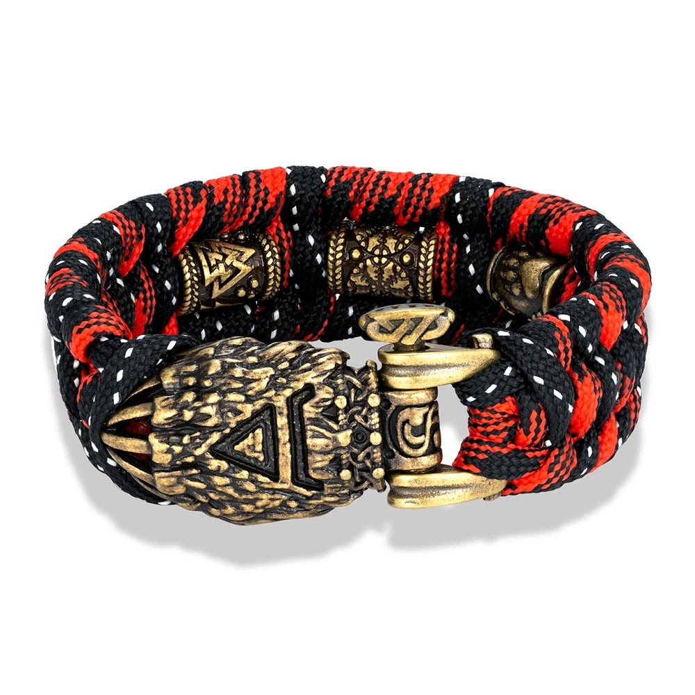 Bracelet with red, black, and gold design on a white background