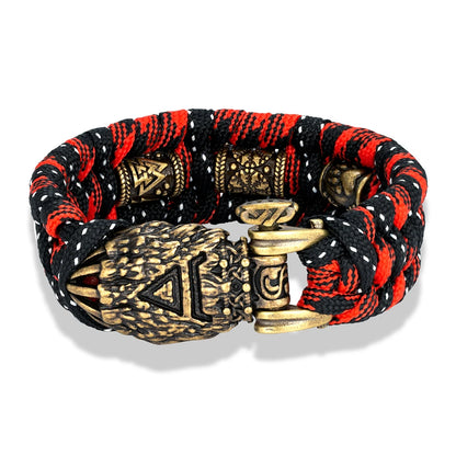 Bracelet with red, black, and gold design on a white background