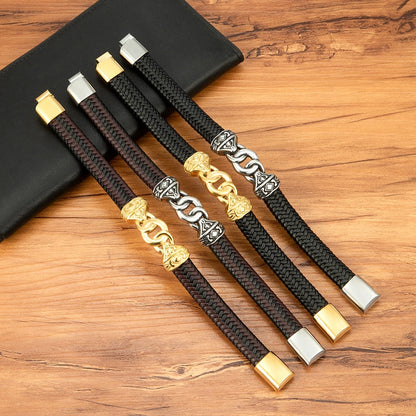 Set of braided bracelets with gold and silver clasps on a wooden surface