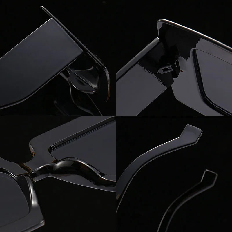 Close-up of a black sunglasses with a dark background