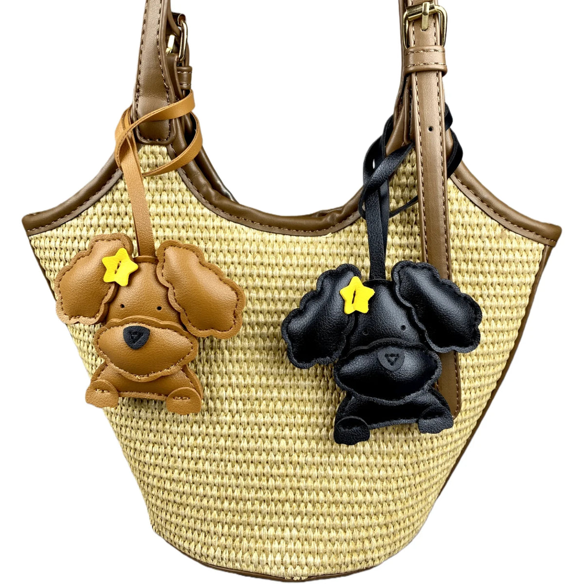 Woven handbag with dog-shaped charms on a white background