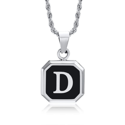 Necklace with a black octagonal pendant featuring the letter 'D' on a white background