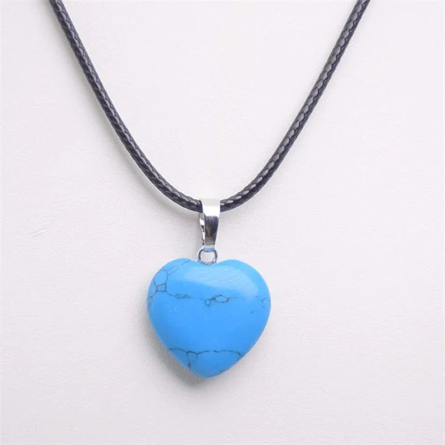 Blue heart-shaped pendant on a black cord against a white background