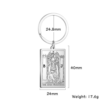 Keychain with tarot card design and measurements on a white background