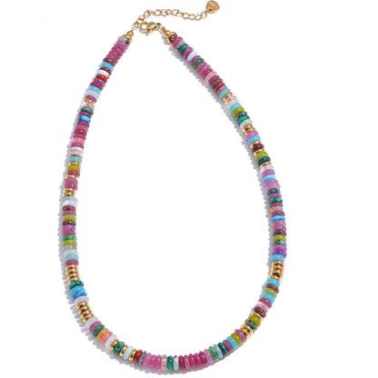 Colourful beaded necklace with a gold chain on a white background
