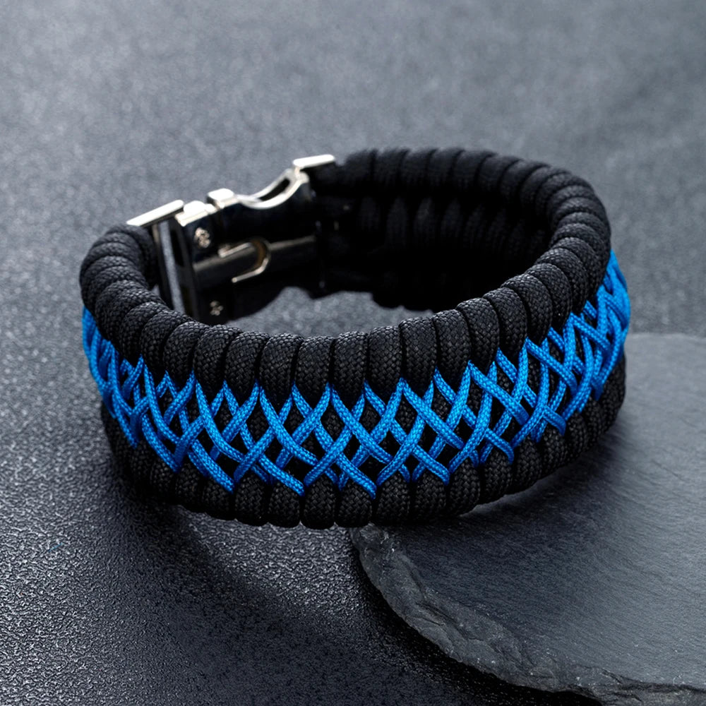 Black and blue braided bracelet on a dark grey background