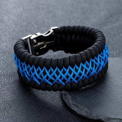 Black and blue braided bracelet on a dark grey background