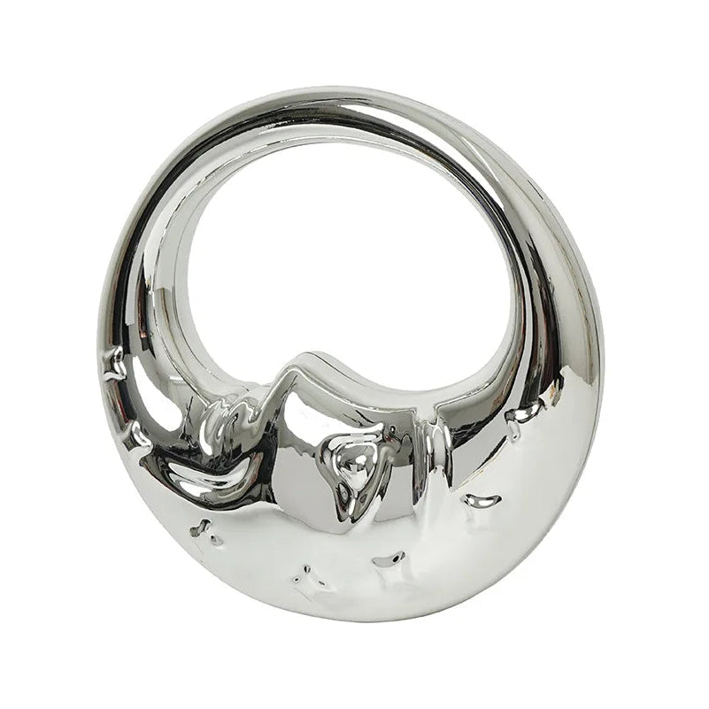 Silver handbag with a moon design on a white background