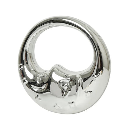 Silver handbag with a moon design on a white background