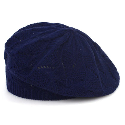 Navy blue knit cap on a white background