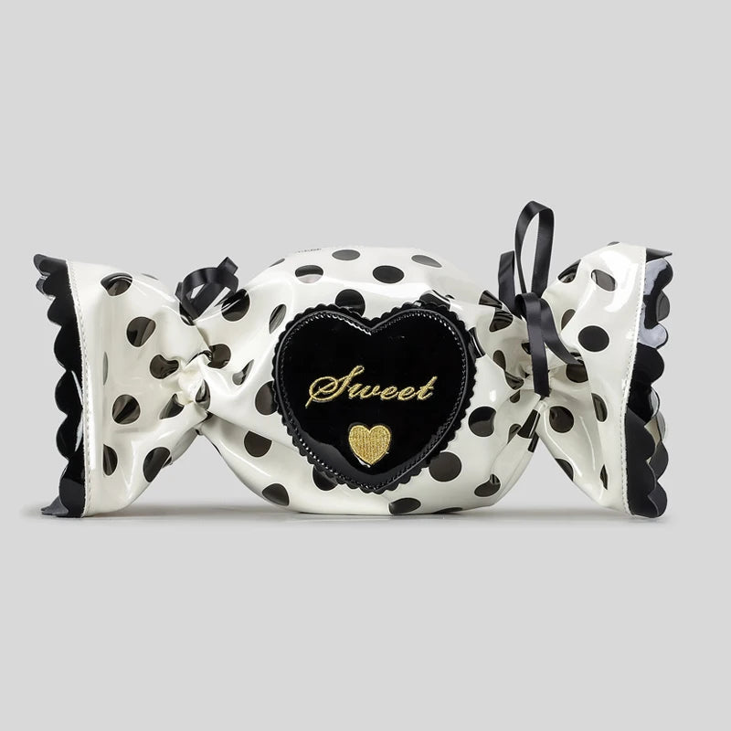 Decorative candy bag with polka dot design and heart-shaped 'Sweet' label on a grey background
