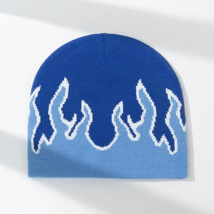 Blue knit beanie with white flame pattern on a white background