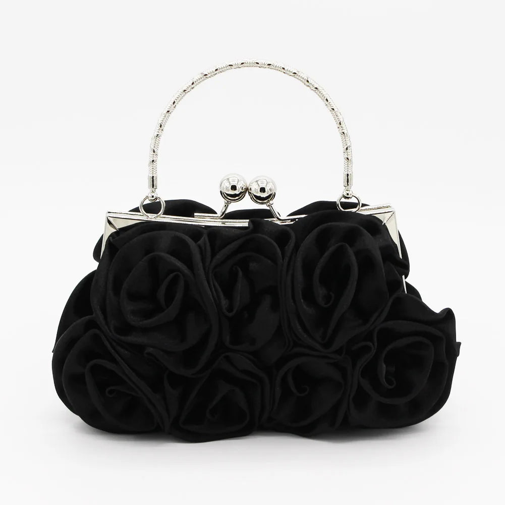 Black rose-themed handbag with a silver clasp on a white background