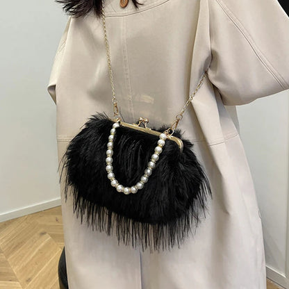 Person wearing a beige coat with a black feathered handbag featuring pearl details.