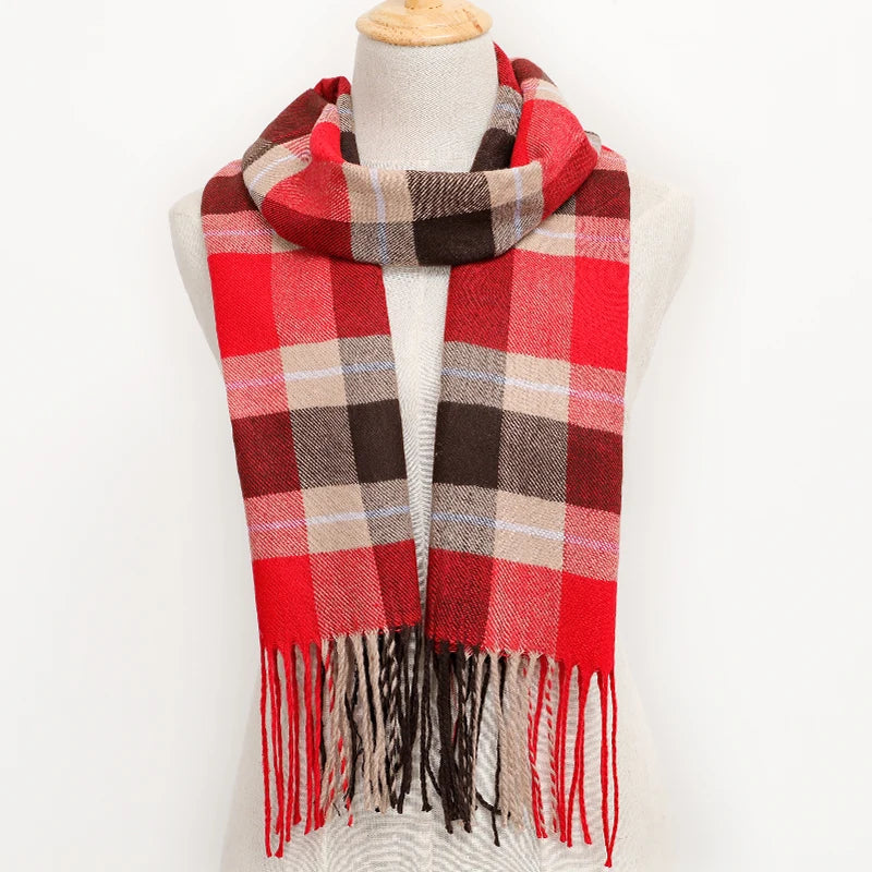 Plaid scarf with red, brown, and beige colours on a mannequin against a white background.