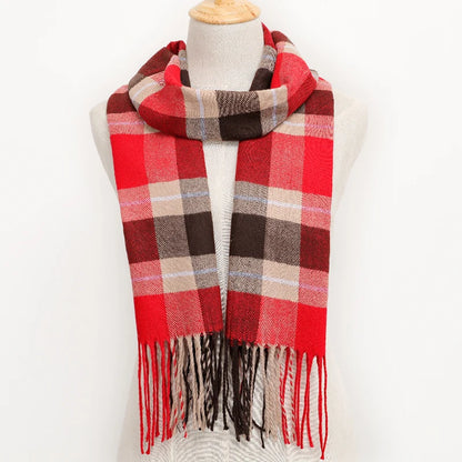 Plaid scarf with red, brown, and beige colours on a mannequin against a white background.
