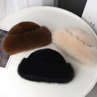 Three fur hats in brown, black, and beige on a white surface.