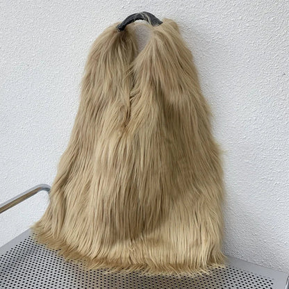 Khaki fluffy fur bag on a trolley against a white wall
