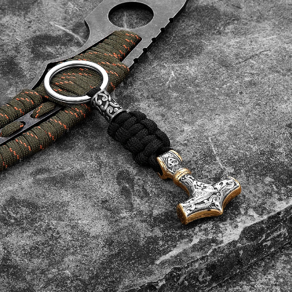 Keychain with Thor's hammer design on a textured surface
