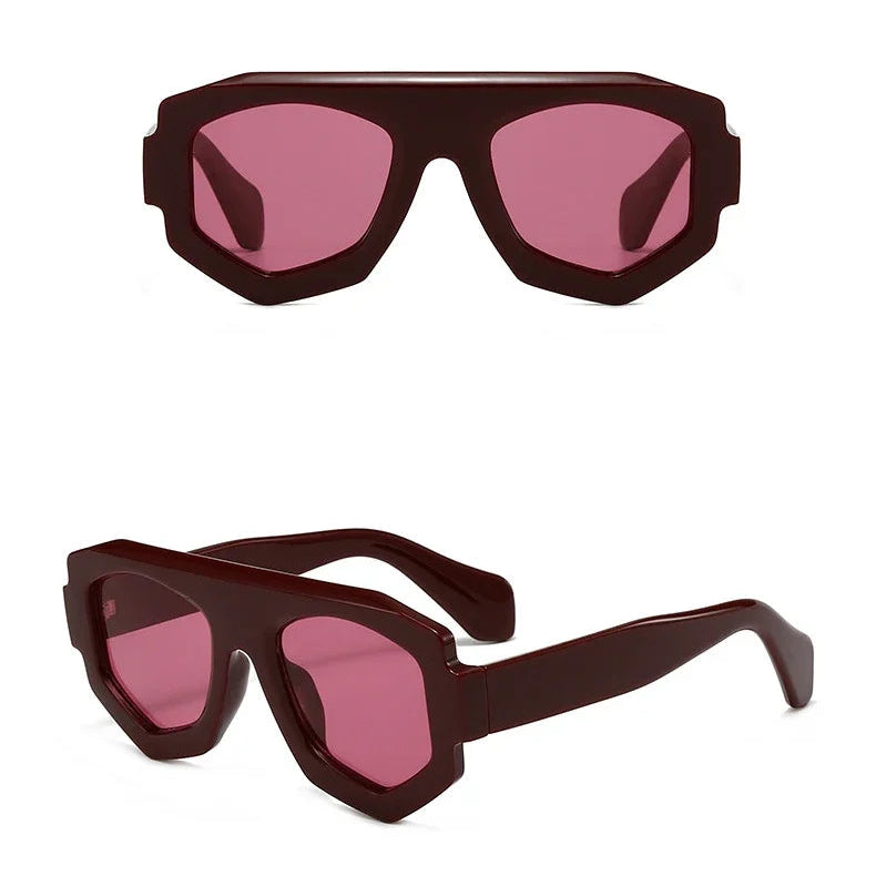 Sunglasses with pink lenses and brown frames on a white background