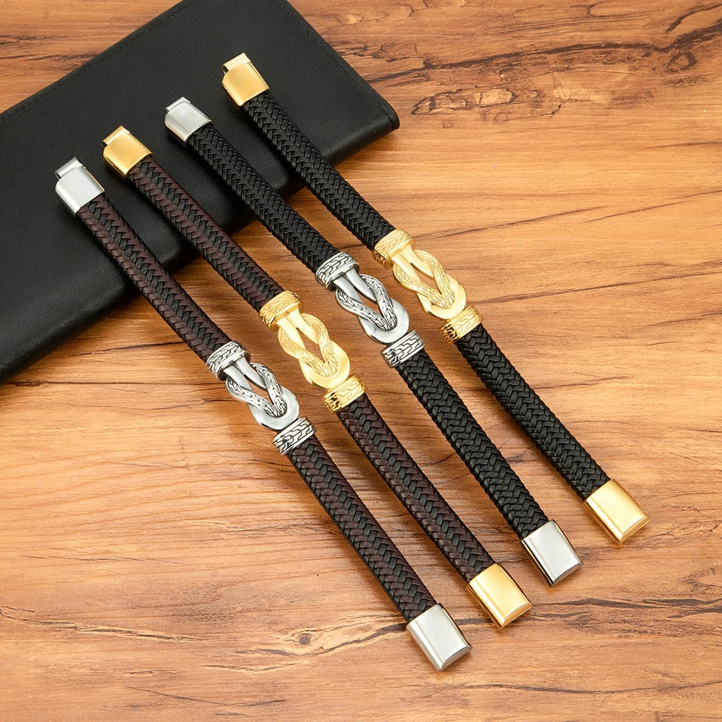 Set of braided bracelets with metal clasps on a wooden surface