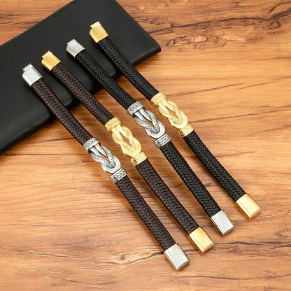Set of braided bracelets with metal clasps on a wooden surface