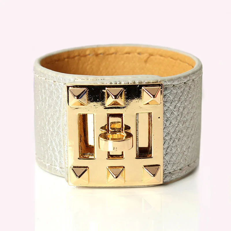 Gold and silver bracelet on a white background