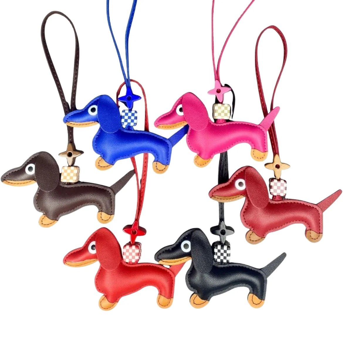Set of colourful dachshund-shaped keychains on a white background