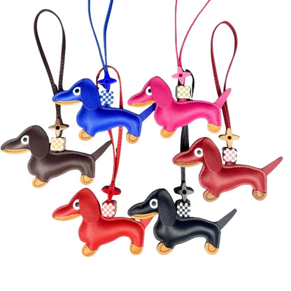 Set of colourful dachshund-shaped keychains on a white background