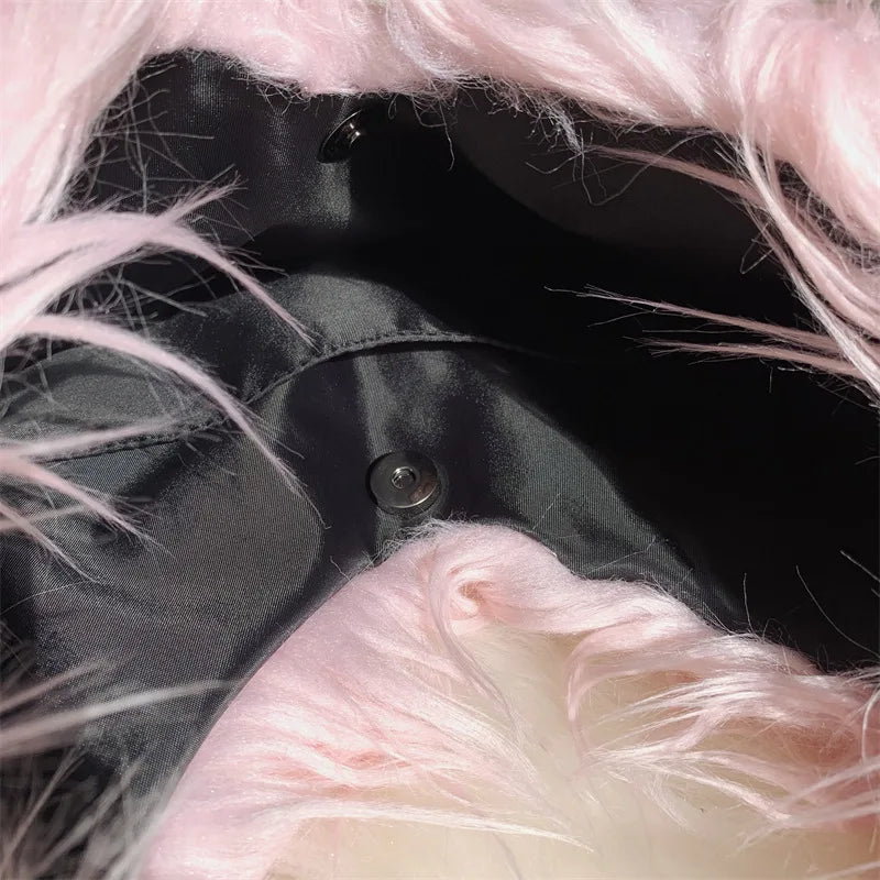 Close-up of a bag with pink fur trim