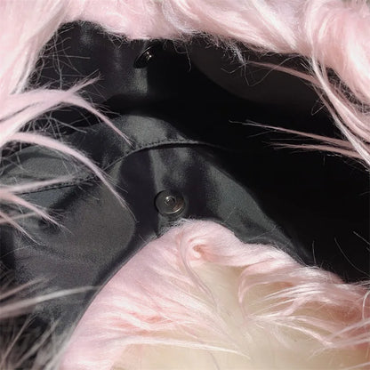 Close-up of a bag with pink fur trim