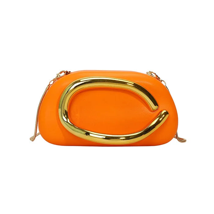Orange clutch bag with gold handle on a white background
