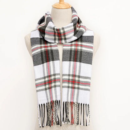 Plaid scarf with fringes on a mannequin against a white background