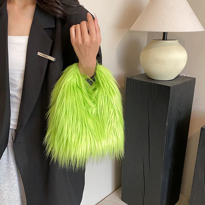 Person holding a bright green fluffy bag indoors with a lamp in the background