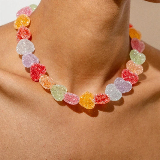 Colourful gummy bear necklace on a person's neck