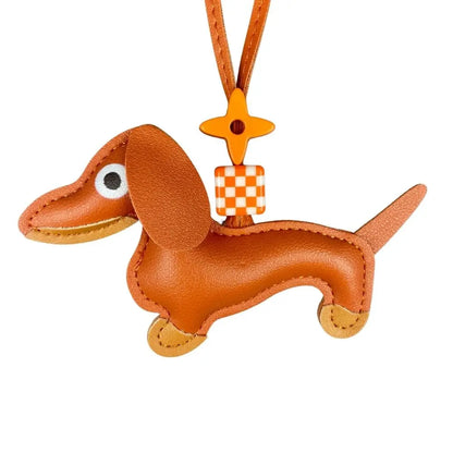 Brown dog-shaped keychain with a checkered tag on a white background