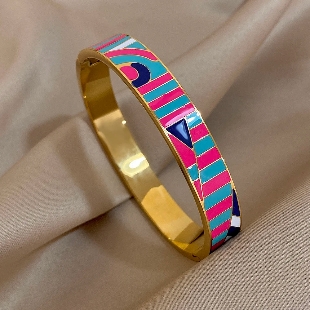 Colourful patterned bangle on a beige fabric background