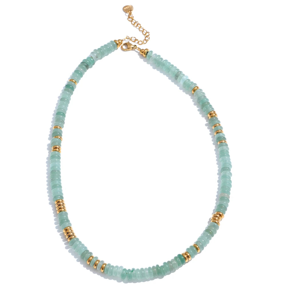 Necklace with light blue beads and gold accents on a white background