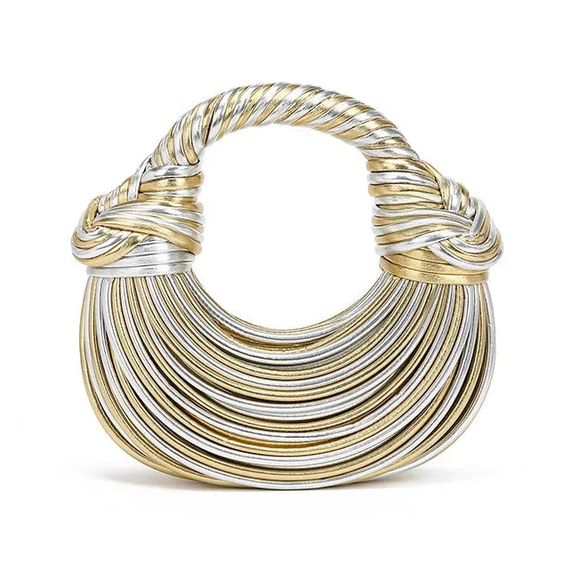 Gold and silver crescent shape handbag on a white background