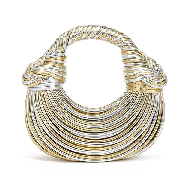 Gold and silver crescent shape handbag on a white background