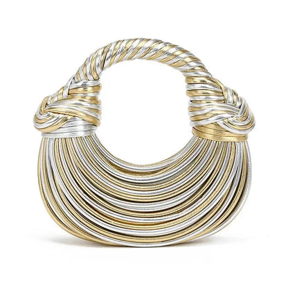 Gold and silver crescent shape handbag on a white background