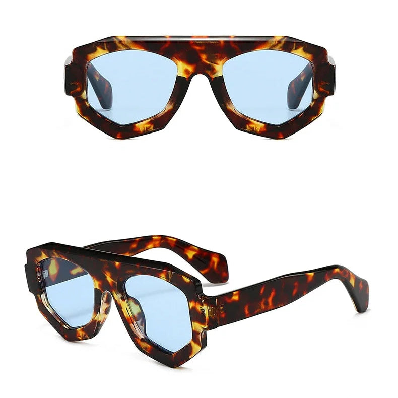 Tortoiseshell sunglasses with blue lenses on a white background