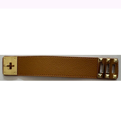Brown leather belt with gold metal buckles on a white background