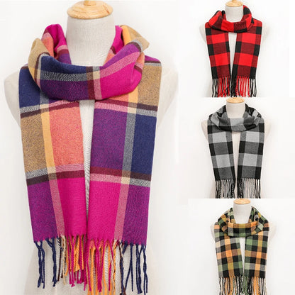 Collection of plaid scarves in various colours on mannequins against a white background.