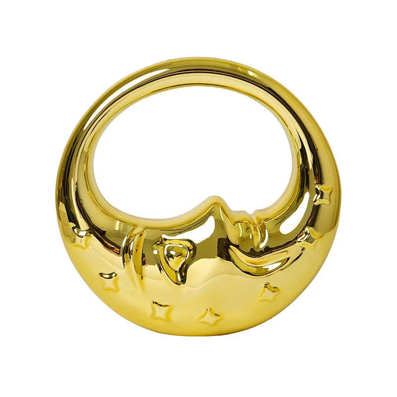 Gold-coloured handbag with a unique design on a white background