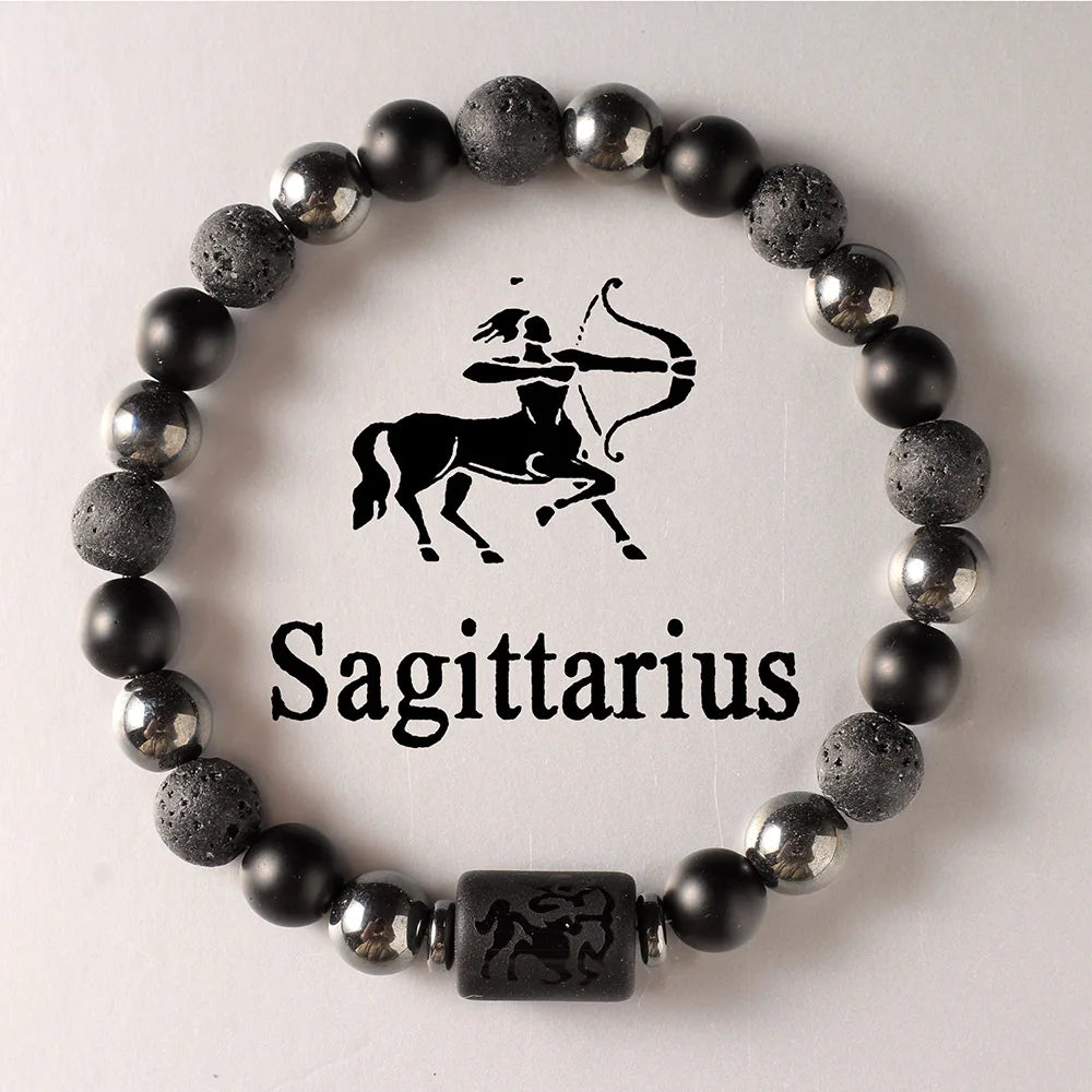 Black beaded bracelet with Sagittarius symbol on a light background