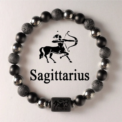 Black beaded bracelet with Sagittarius symbol on a light background
