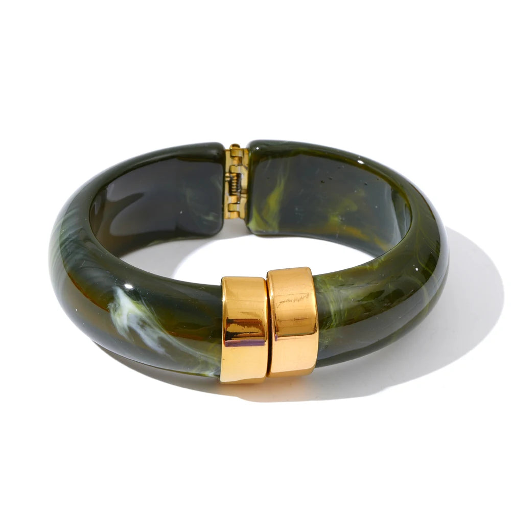 Green marbled bangle with gold clasp on a white background